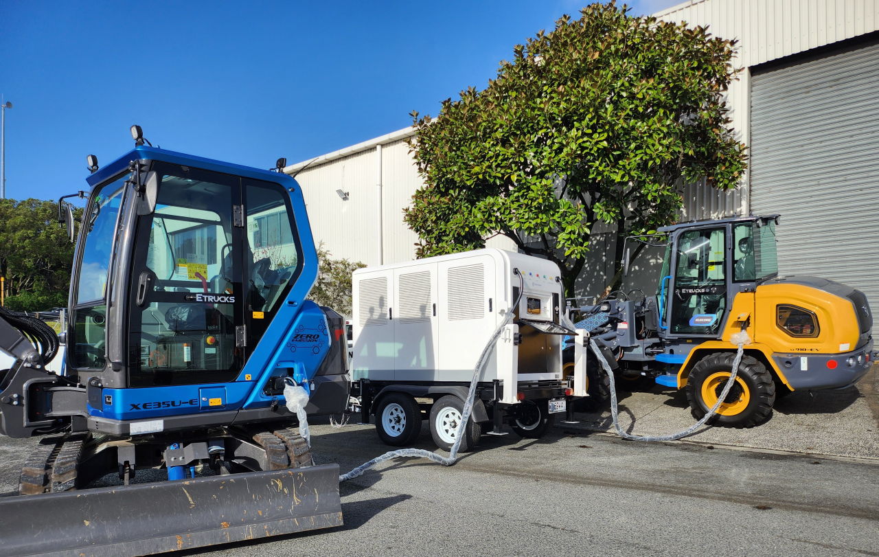 Charging trailer loader and excavator